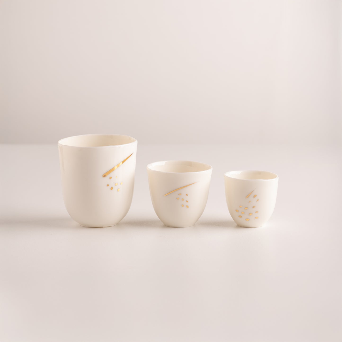 Set of two espresso cups with gold