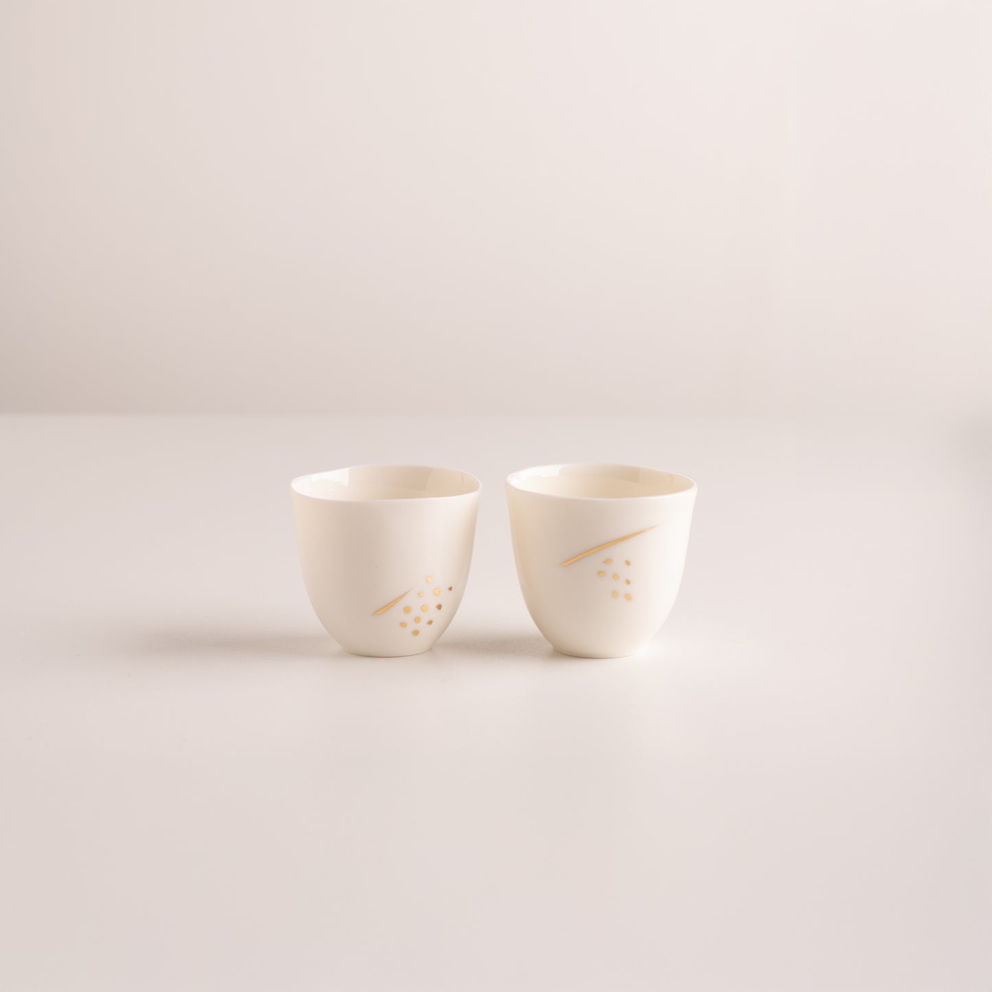 Set of two espresso cups with gold